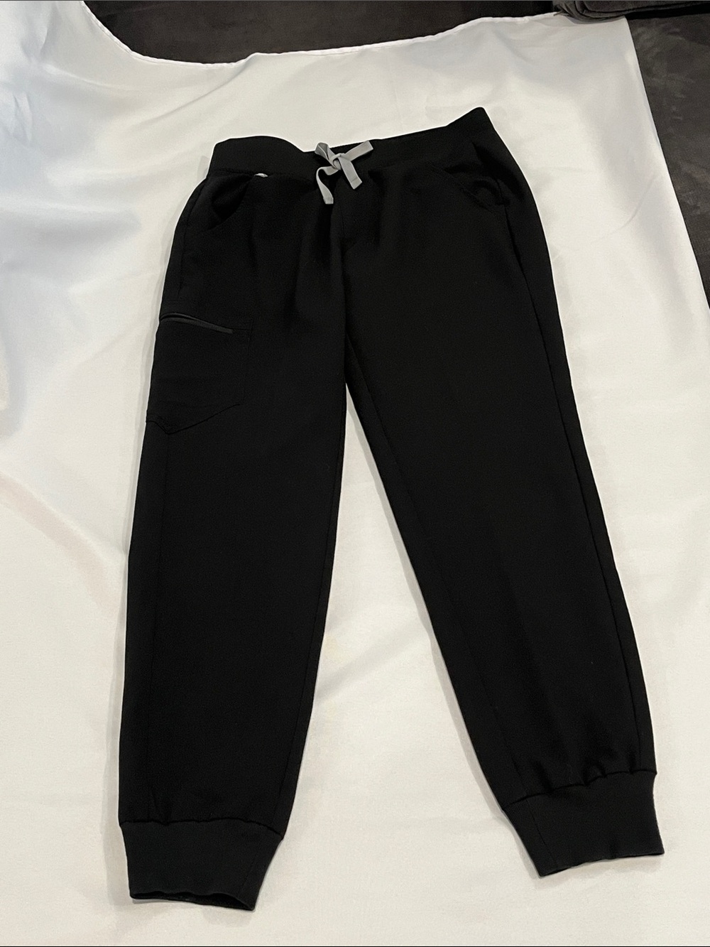 FIGS Black Scrub Jogger Pants with Light Gray Drawstring. Inside security pocket